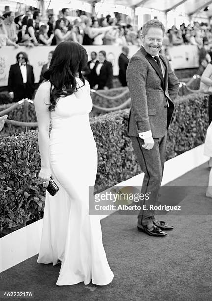 An aternative view of actors Ariel Winter and Jesse Tyler Ferguson as they arrive at the 21st Annual Screen Actors Guild Awards at The Shrine...