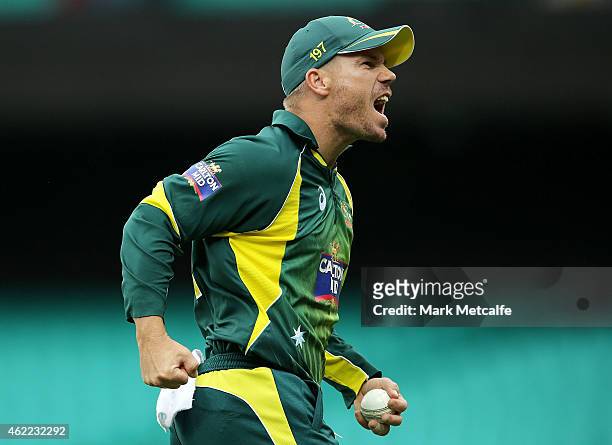 David Warner of Australia celebrates after taking a catch to dismiss Ambati Rayudu of India off the bowling of Mitchell Marsh during the One Day...