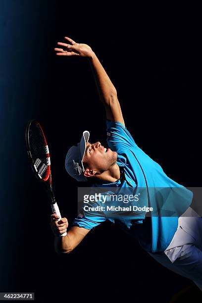 Jerzy Janowicz of Poland serves in his first round match against Jordan Thompson of Australia during day one of the 2014 Australian Open at Melbourne...