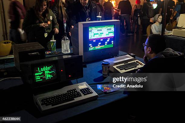 An attendee plays Frogger on one of the earliest computers made at MAGfest 13 in National Harbor, Md. On January 24, 2015. MAGfest is an annual...