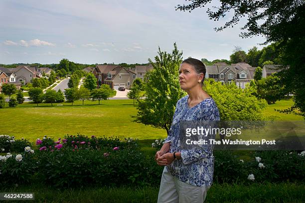 Ambler Bowie Slabe, great great granddaughter of former Maryland Governor, Oden Bowie, walks the yard of 140 year old plantation house with on May...