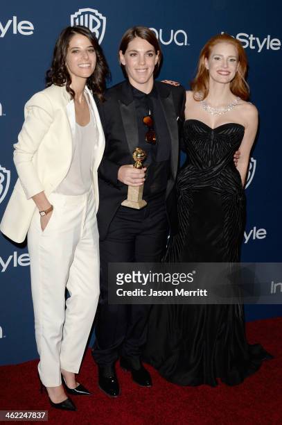 Robyn Shapiro, producer Megan Ellison, winner of Best Motion Picture - Musical or Comedy for 'American Hustle,' and actress Jessica Chastain attend...