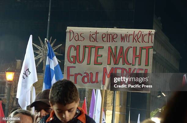 Supporters hold a picket that reads 'This is A Good Night Miss Merkel' refering to the German Chancellour Angela Merkel that many Greeks feel is...