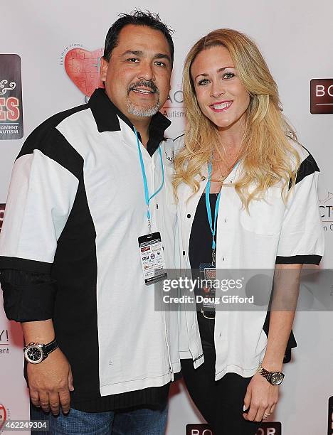 Retired 2-time MLB All-Star Pitcher and founder of Eddie Guardado Foundation, Eddie Guardado and Olympic Gold Medalist swimmer, Kaitlin Sandeno pose...