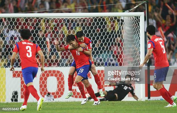 Kim Young Gwon of Korea Republic celebrates with team mates after scoring the second goal during the Asian Cup Semi Final match between Korea...