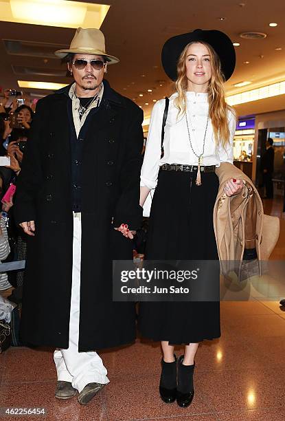 Johnny Depp and Amber Heard are seen upon arrival at Haneda Airport on January 26, 2015 in Tokyo, Japan.