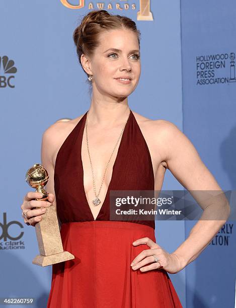 Actress Amy Adams, winner of Best Actress in a Motion Picture - Musical or Comedy for 'American Hustle,' poses in the press room during the 71st...