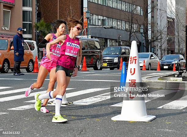 Tatiana Gamera of Russia and Risa Shigetomo of Japan compete during the 2015 Osaka Women's Marathon on January 25, 2015 in Osaka, Japan.