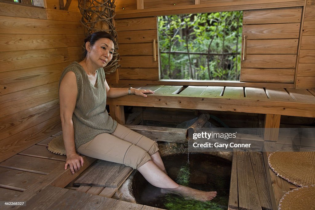 Woman enjoys Japanese foot soak