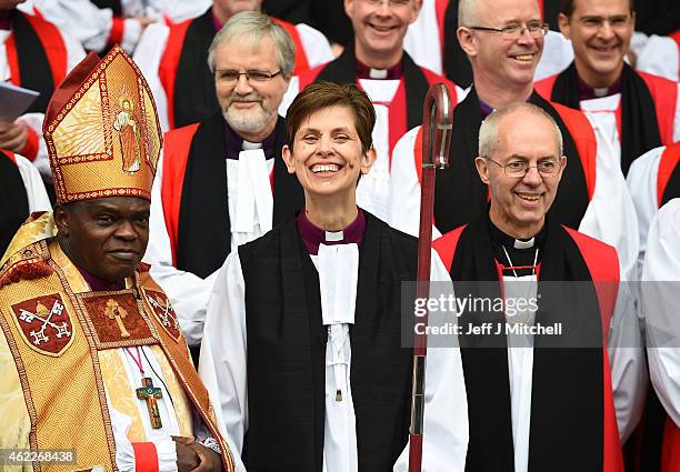 The Reverend Libby Lane smiles as she stands next to the Archbishop of Canterbury, Justin Welby, and the Archbishop of York, Dr John Sentamu outside...