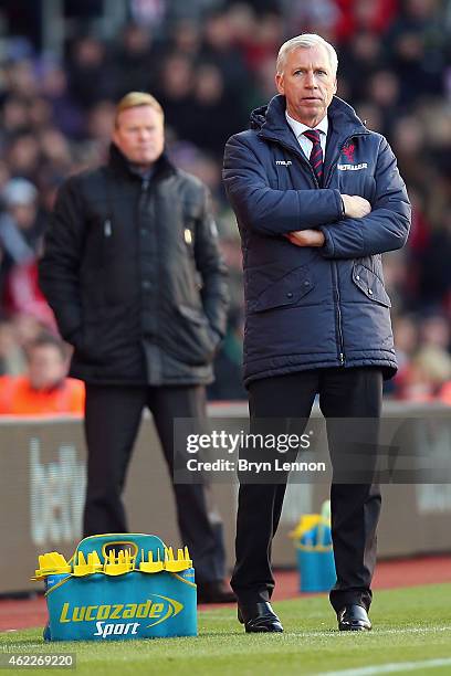 Alan Pardew manager of Crystal Palace and Ronald Koeman manager of Southampton look on from the touchline during the FA Cup Fourth Round match...