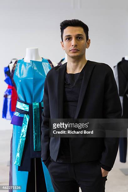 Designer Rad Hourani poses during the Rad Hourani presentation as part of the Paris Fashion Week Haute Couture Spring/Summer 2015 at the Canada...