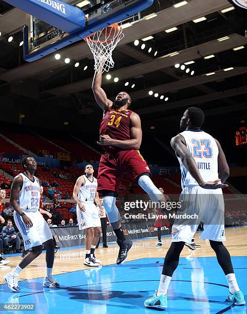 Arinze Onuaku of the Canton Charge shoots the ball against Semaj Christon, Mario Little and Grant Jerrett of the Oklahoma City Blue during an NBA...