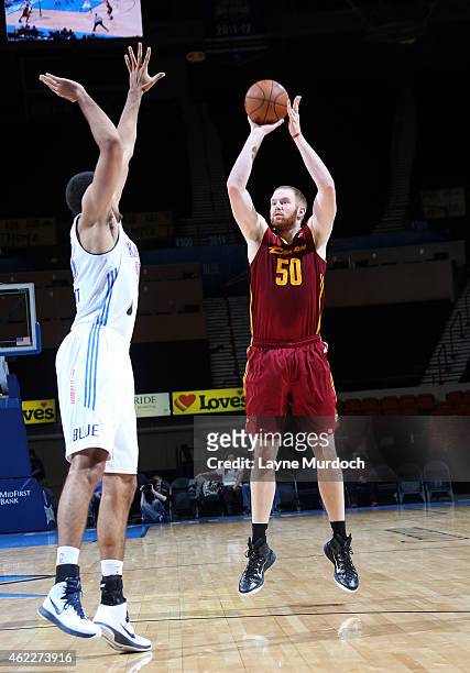 Alex Kirk of the Canton Charge shoots the ball against Grant Jerrett of the Oklahoma City Blue during an NBA D-League game on January 23, 2015 at the...