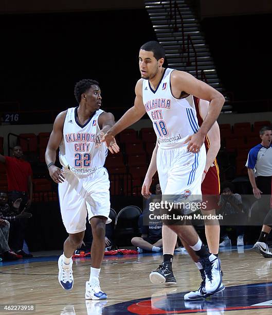 Semaj Christon of the Oklahoma City Blue slaps hands with teammate Grant Jerrett against the Canton Charge during an NBA D-League game on January 23,...