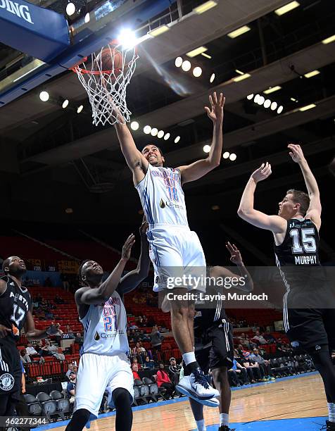 Grant Jerrett of the Oklahoma City Blue dunks against Erik Murphy and Jonathon Simmons of the Austin Spurs during an NBA D-League game on January 24,...