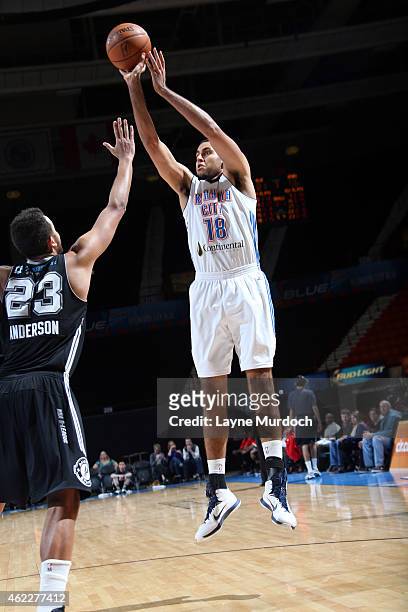 Grant Jerrett of the Oklahoma City Blue shoots against Kyle Anderson of the Austin Spurs during an NBA D-League game on January 24, 2015 at the Cox...