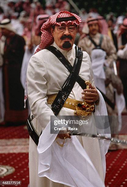 Abdullah bin Abdulaziz Al Saud, then prince and later King of Saudi Arabia, during the traditional Bedouin sabre dance called Arda.