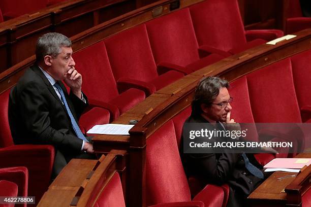 Righ-wing opposition party members of parliament Henri Guaino and Frederic Lefebvre attend the first day of a debate on a draft bill, know as the...