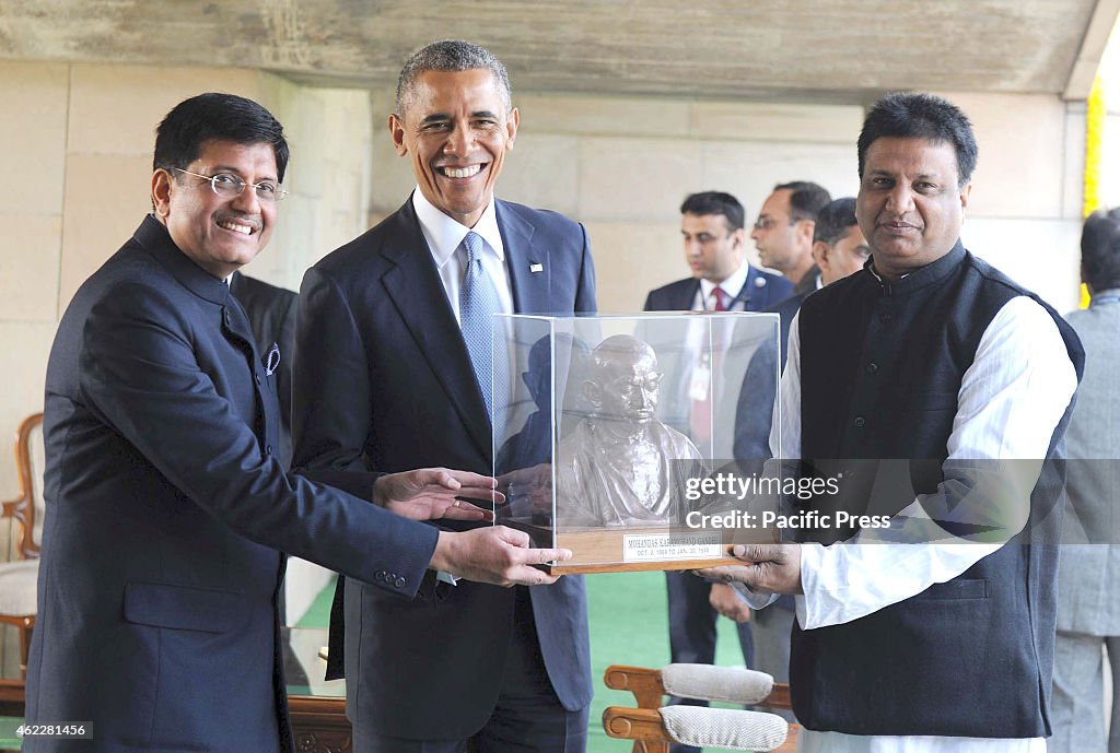 The US President, Mr. Barack Obama being presented a bust of...