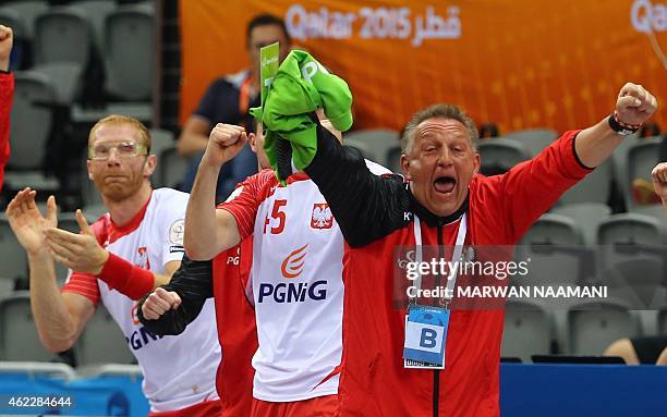 Poland's coach Michael Biegler celebrates their win during the 24th Men's Handball World Championships Eighth Final EF2 match between Poland and...