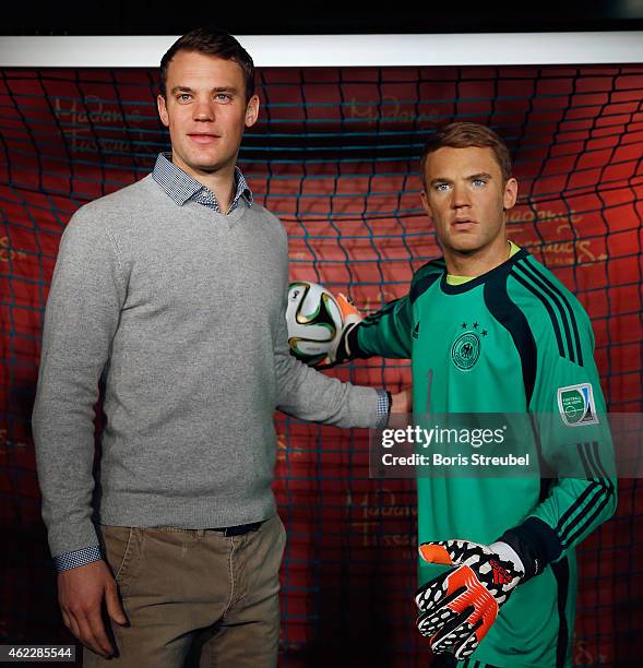 Goalkeeper Manuel Neuer of Germany pose with his wax figure at Madame Tussauds on January 26, 2015 in Berlin, Germany.