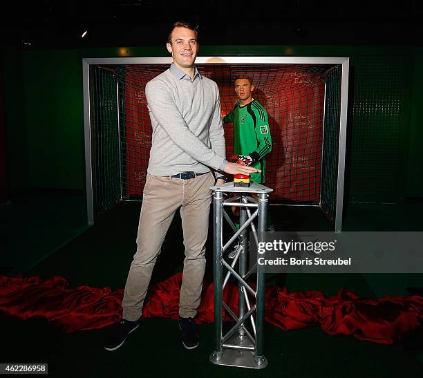 Goalkeeper Manuel Neuer of Germany unveils his wax figure at Madame Tussauds on January 26, 2015 in Berlin, Germany.