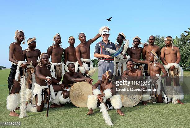 Louis Oosthuizen of South Africa holds the trophy in amongst local dancers after his victory during the final round of the 2014 Volvo Golf Champions...