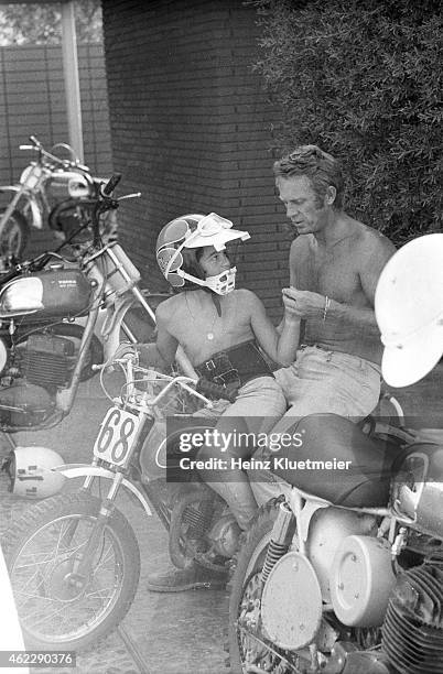 Portrait of celebrity actor Steve McQueen with his son, Chad McQueen, and his bike collection in his garage. Palm Springs, CA 6/13/1971 CREDIT: Heinz...