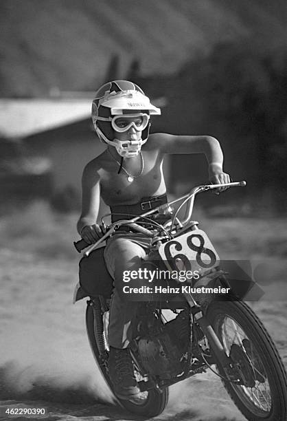 Portrait of Chad McQueen, son of celebrity actor Steve McQueen, riding a motorbike during photo shoot in the Mojave Desert. Palm Springs, CA...