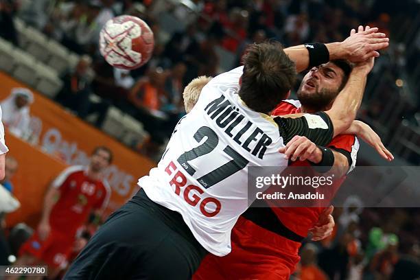 Germany's Michael Muller in action against Egypt's Mahmoud Radwan during the 24th Men's Handball World Championship second tour between Germany and...