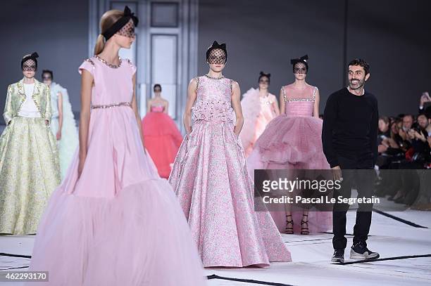 Fashion designer Giambattista Valli acknowledges the applause of the audience after the his show as part of Paris Fashion Week Haute Couture...