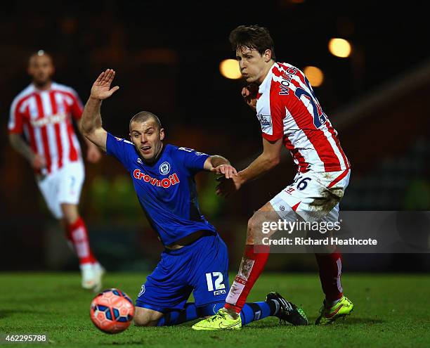 Marc Wilson of Stoke City tussles for the ball with Philipp Wollscheid of Stoke City during the FA Cup fourth round match between Rochdale and Stoke...