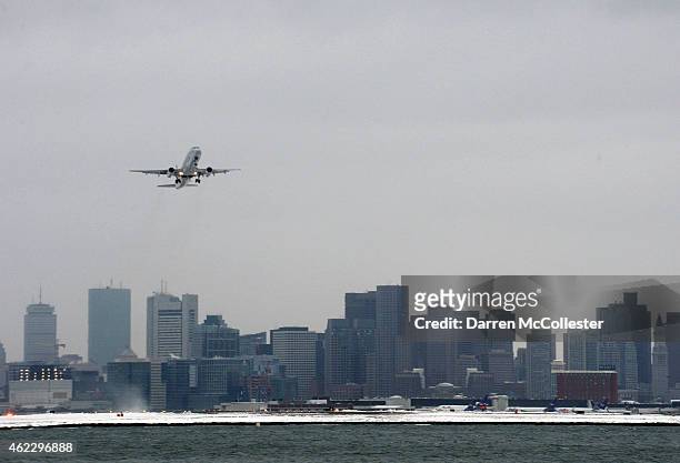 Flight takes off from Logan International Airport ahead of a massive storm expected to hit the region later today January 26, 2015 in Winthrop,...