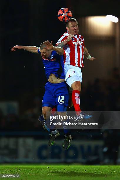 Stephen Dawson of Rochdale and Glenn Whelan of Stoke City during the FA Cup fourth round match between Rochdale and Stoke City at Spotland Stadium on...