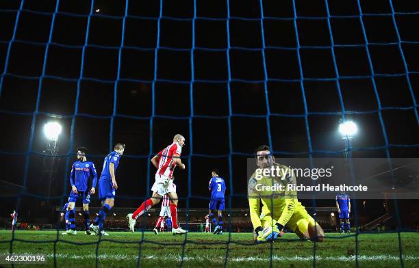 Dejected Josh Lillis of Rochdale looks on after conceding the third goal during the FA Cup fourth round match between Rochdale and Stoke City at...