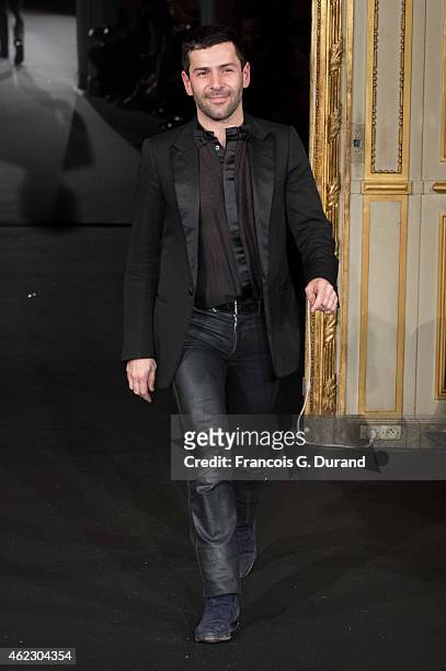 Designer Alexis Mabille appears on the catwalk after presenting the Alexis Mabille show as part of Paris Fashion Week Haute Couture Spring/Summer...