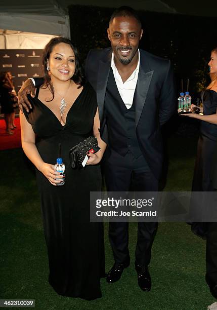 Actor Idris Elba and a guest attend The Weinstein Company & Netflix's 2014 Golden Globes After Party presented by Bombardier, FIJI Water, Lexus,...