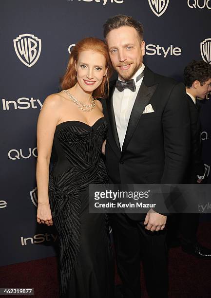 Actress Jessica Chastain and Editor of InStyle Ariel Foxman attend the 2014 InStyle And Warner Bros. 71st Annual Golden Globe Awards Post-Party at...