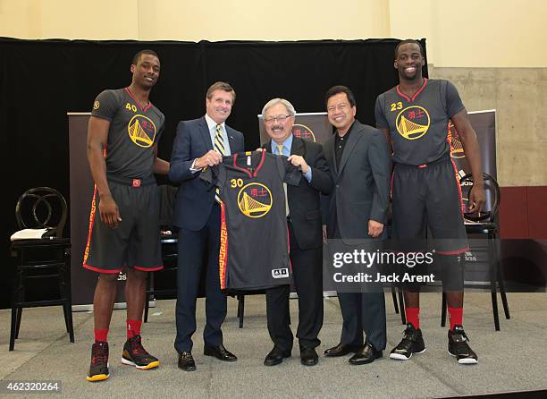 Harrison Barnes, President and Chief Operating Officer Rick Welts, San Francisco Mayor Ed Lee and Draymond Green of the Golden State Warriors pose...