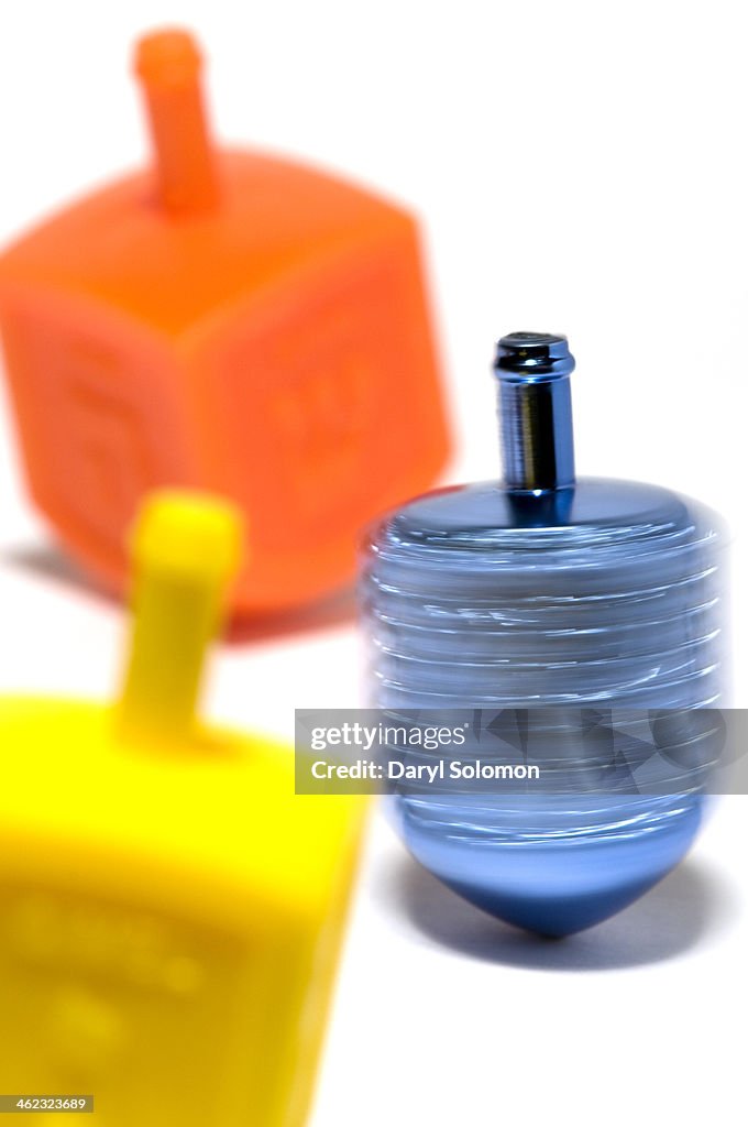 Three dpinning dreidels