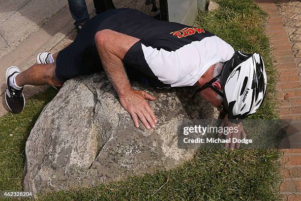 Blues coach Michael Malthouse lays on a rock after riding up Mount Buller during the Carlton Blues AFL training camp on January 27, 2015 in Mount...