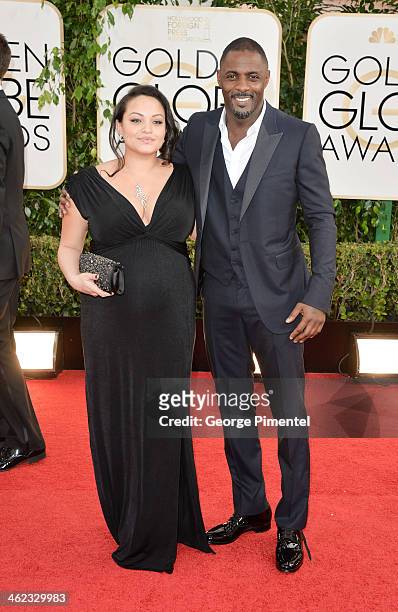 Actor Idris Elba and Naiyana Garth arrive at the 71st Annual Golden Globe Awards at The Beverly Hilton Hotel on January 12, 2014 in Beverly Hills,...