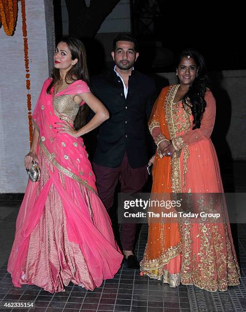 Arpita Khan and Amrita Arora with her husband Shakeel Ladak at Soha Ali Khan and Kunal Khemus wedding reception in Mumbai.