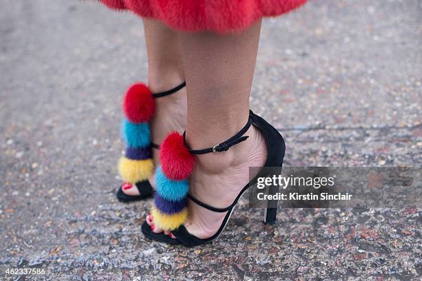 Jewelry designer Natashe Zinko wears a Dior coat, Brian Atwood shoes on day 2 of Paris Haute Couture Fashion Week Spring/Summer 2015, on January 26,...