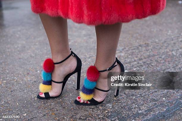 Jewelry designer Natashe Zinko wears a Dior coat, Brian Atwood shoes on day 2 of Paris Haute Couture Fashion Week Spring/Summer 2015, on January 26,...