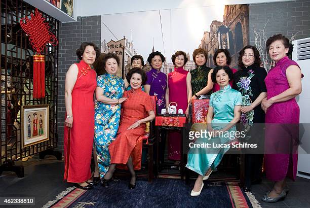 April 19: Wang Weiyu, seated in blue, poses with her students, all wearing Qipao traditional dresses, in her Qipao salon on April 19, 2010 in...