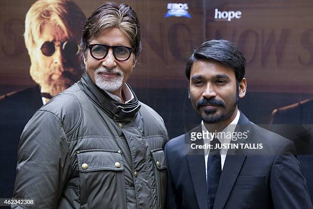 Indian actors Amitabh Bachchan and Dhanush pose for photographers at a photocall for the film 'Shamitabh' in central London on January 27, 2015. AFP...