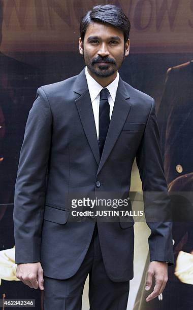 Indian actor Dhanush poses for photographers at a photocall for the film 'Shamitabh' in central London on January 27, 2015. AFP PHOTO / JUSTIN TALLIS