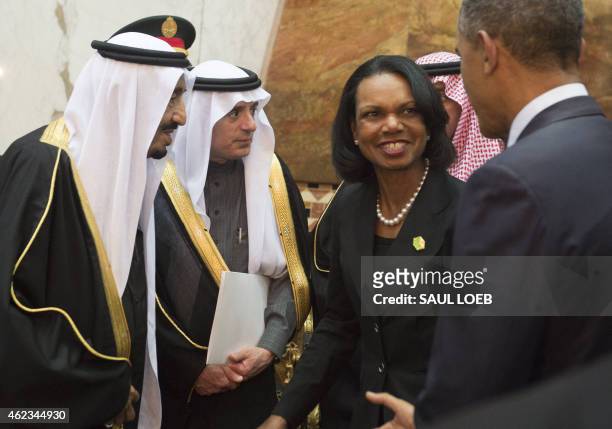 Saudi new King Salman greets former US Secretary of State Condoleezza Rice , alongside US President Barack Obama, at the Erga Palace in the capital...
